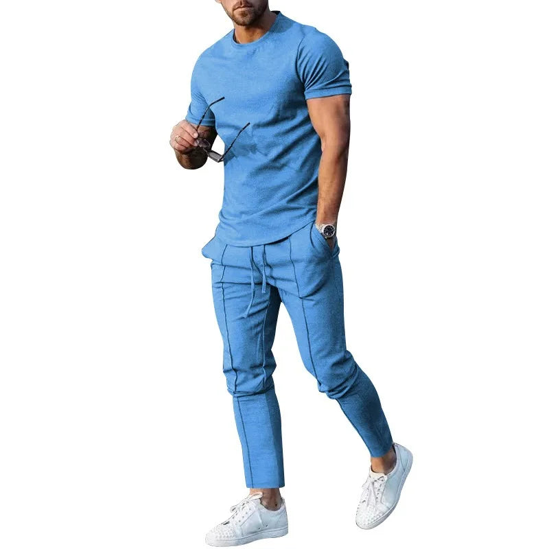 M-3XL Ensemble de sport pour homme : t-shirt de sport uni à col rond et manches courtes + pantalon à poche, ensemble deux pièces de style streetwear